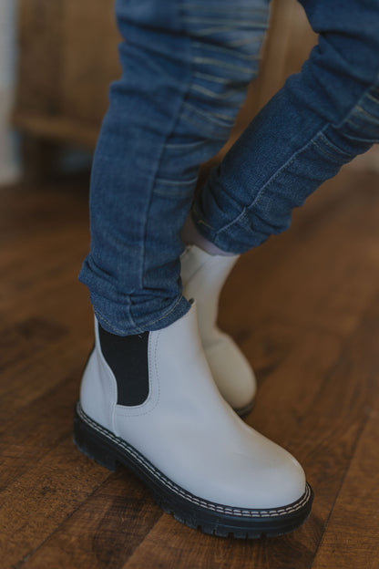 CAYLIE GIRLS WHITE BOOTIE WITH BLACK SOLE AND DETAILS